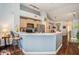 Bright open kitchen boasts light wood cabinets, breakfast bar, stainless steel appliances, and ample storage at 1107 Normandy Trace Rd, Tampa, FL 33602