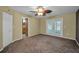 Bedroom featuring french doors, ceiling fan, neutral walls and carpet at 11279 Oakridge Trl, Seminole, FL 33772