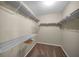 Spacious closet featuring multiple wire shelves and carpeted floors at 11279 Oakridge Trl, Seminole, FL 33772