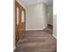 Spacious foyer featuring hardwood floors and a solid wood door with decorative glass inserts at 11279 Oakridge Trl, Seminole, FL 33772