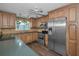 Well-equipped kitchen featuring stainless steel appliances and ample cabinet space at 11279 Oakridge Trl, Seminole, FL 33772