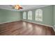 Clean, unfurnished living room offering ample natural light through beautiful, arched windows at 11279 Oakridge Trl, Seminole, FL 33772