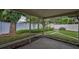 Back patio with landscaping and fenced yard at 11279 Oakridge Trl, Seminole, FL 33772