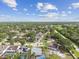Sprawling neighborhood featuring well-maintained homes with lush green landscaping and mature trees on a bright day at 11304 Plumtree Ct, Riverview, FL 33579
