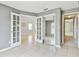 Bedroom with tile floors and french doors, perfect for office or guest room at 11304 Plumtree Ct, Riverview, FL 33579