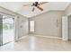 Bedroom featuring tile floors, ceiling fan, and neutral paint, providing a serene atmosphere at 11304 Plumtree Ct, Riverview, FL 33579