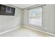 Bedroom with tile floors, large window, and neutral gray walls at 11304 Plumtree Ct, Riverview, FL 33579