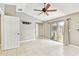 Bright bedroom with tile flooring, ceiling fan, and sliding glass doors to the outdoor patio at 11304 Plumtree Ct, Riverview, FL 33579
