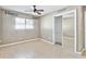 This bedroom offers tile flooring, a ceiling fan, and a mirrored closet at 11304 Plumtree Ct, Riverview, FL 33579