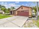 Welcoming single-story home with a vibrant lawn and elegant palm trees, blending comfort with tropical charm at 11304 Plumtree Ct, Riverview, FL 33579