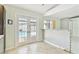 Bright eat-in kitchen area with tile floors, and double doors that provide views of the pool at 11304 Plumtree Ct, Riverview, FL 33579
