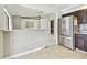 Open concept kitchen with stainless steel appliances, breakfast bar, and tile flooring at 11304 Plumtree Ct, Riverview, FL 33579