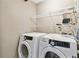 Laundry room featuring Samsung washer and dryer and wire shelving at 11304 Plumtree Ct, Riverview, FL 33579