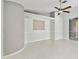 This living room features tile flooring and a ceiling fan at 11304 Plumtree Ct, Riverview, FL 33579