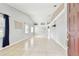 Bright and airy living room with tile flooring, neutral walls, and ample natural light from large windows at 11304 Plumtree Ct, Riverview, FL 33579