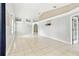 Spacious living room with tile flooring, high ceilings, and neutral walls, offering a versatile living space at 11304 Plumtree Ct, Riverview, FL 33579