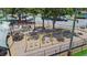Community playground with swings, play structures, picnic tables, and mature trees at 11304 Plumtree Ct, Riverview, FL 33579