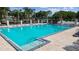 Community pool with lounge chairs and stairs entry to the pool at 11304 Plumtree Ct, Riverview, FL 33579