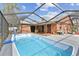 Large screened pool area, providing a private backyard oasis for swimming and lounging at 11304 Plumtree Ct, Riverview, FL 33579