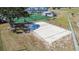 Aerial view of sand volleyball court next to other sporting areas and greenery, ideal for community recreation at 11304 Plumtree Ct, Riverview, FL 33579