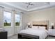 Inviting bedroom with scenic views, neutral tones and comfortable furnishings at 12574 Somatic Ct, Venice, FL 34293