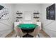 Fun game room features a green game table and stylish decor, perfect for entertaining at 12574 Somatic Ct, Venice, FL 34293