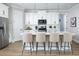 Stylish kitchen featuring a center island with seating, modern appliances, and ample cabinet space at 12574 Somatic Ct, Venice, FL 34293