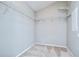Walk-in closet with wire shelving and neutral carpeting for ample storage at 15126 Shearcrest Dr, Lithia, FL 33547
