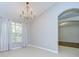 Bright dining room featuring tile flooring, a chandelier, and a view of the green outdoors at 15126 Shearcrest Dr, Lithia, FL 33547