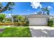 Charming single-story home features a well-maintained lawn and a two-car garage at 15126 Shearcrest Dr, Lithia, FL 33547