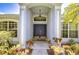 Inviting front entrance featuring a double door and decorative plants at 15126 Shearcrest Dr, Lithia, FL 33547