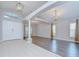 Inviting living room with tile and wood floors, elegant chandeliers, and neutral paint at 15126 Shearcrest Dr, Lithia, FL 33547