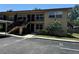 Exterior view of two-story building with parking at 2501 Harn Blvd # H20, Clearwater, FL 33764