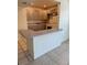 Kitchen with tiled floors, light gray cabinets and white appliances at 2501 Harn Blvd # H20, Clearwater, FL 33764