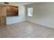 Open living area with view into the kitchen area at 2501 Harn Blvd # H20, Clearwater, FL 33764
