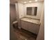 Bathroom featuring a granite countertop vanity, modern sink, and neutral decor at 2617 Cove Cay Dr # 306, Clearwater, FL 33760