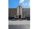 Exterior view of the building, highlighting its architectural details and landscaping at 2617 Cove Cay Dr # 306, Clearwater, FL 33760