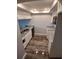 Modern kitchen with granite counters, updated appliances, and wood-style flooring at 2617 Cove Cay Dr # 306, Clearwater, FL 33760