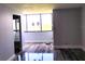 Living room featuring wood floors and a large window for natural light at 2617 Cove Cay Dr # 306, Clearwater, FL 33760
