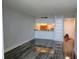 Open-concept living room area with views of a kitchen and wood flooring at 2617 Cove Cay Dr # 306, Clearwater, FL 33760