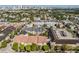 Wide aerial shot of neighborhood showcasing various residential buildings and a distant city skyline, with ample greenery at 501 S Moody Ave # 1134, Tampa, FL 33609