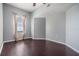 Bright bedroom with hardwood floors, neutral walls and large window with linen curtains at 501 S Moody Ave # 1134, Tampa, FL 33609