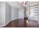 Bedroom with hardwood floors, neutral paint, and custom built-in shelving with storage at 501 S Moody Ave # 1134, Tampa, FL 33609