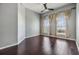 Bedroom featuring hardwood floors, neutral paint and bright windows with tan curtains at 501 S Moody Ave # 1134, Tampa, FL 33609