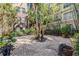Beautiful outdoor courtyard with lush greenery, seating and mature trees at 501 S Moody Ave # 1134, Tampa, FL 33609