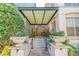 Inviting entryway with an attractive awning, manicured landscaping, and tiled stairs leading to the building's entrance at 501 S Moody Ave # 1134, Tampa, FL 33609