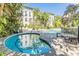 Relaxing hot tub and bench seating area in the community at 501 S Moody Ave # 1134, Tampa, FL 33609