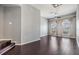 Open living area featuring sleek dark hardwood floors, a ceiling fan, and bright windows at 501 S Moody Ave # 1134, Tampa, FL 33609
