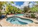 Inviting pool and spa area surrounded by lush tropical landscaping offering a relaxing oasis at 501 S Moody Ave # 1134, Tampa, FL 33609