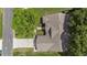 Bird's-eye view showcasing the home's layout, driveway, and landscaping within a well-maintained neighborhood at 5092 Abagail Dr, Spring Hill, FL 34608